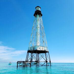 Alligator Reef Lighthouse in Islamorada, Florida Keys Alligator Reef Lighthouse standing offshore in the clear blue water of Islamorada, Florida Keys
