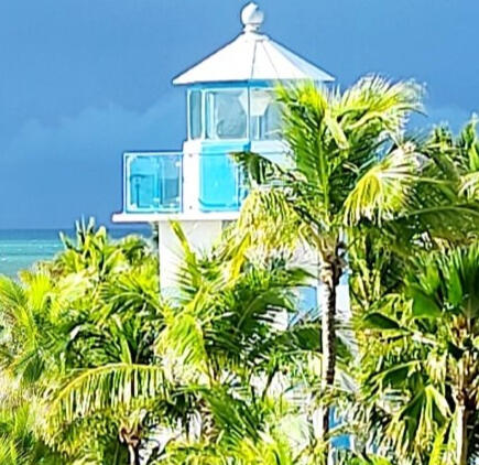 Florida Keys lighthouse with palm trees Palm trees and lighthouse in the Florida Keys